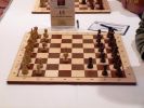 When Anand could use in simul the power of his opening preparation, Alexandra had to create over the board. She played Chess960-Simultan